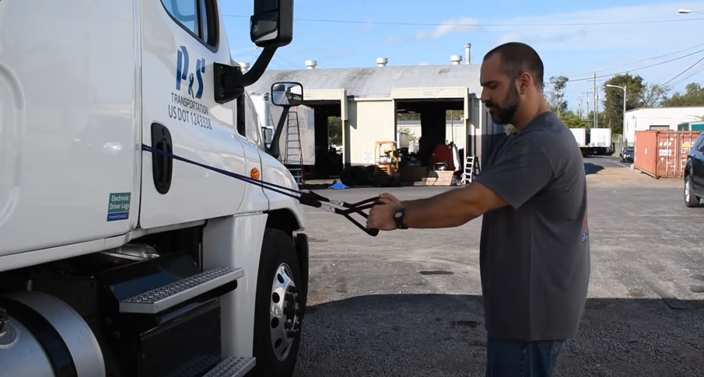 truck driver doing workouts outside of his truck